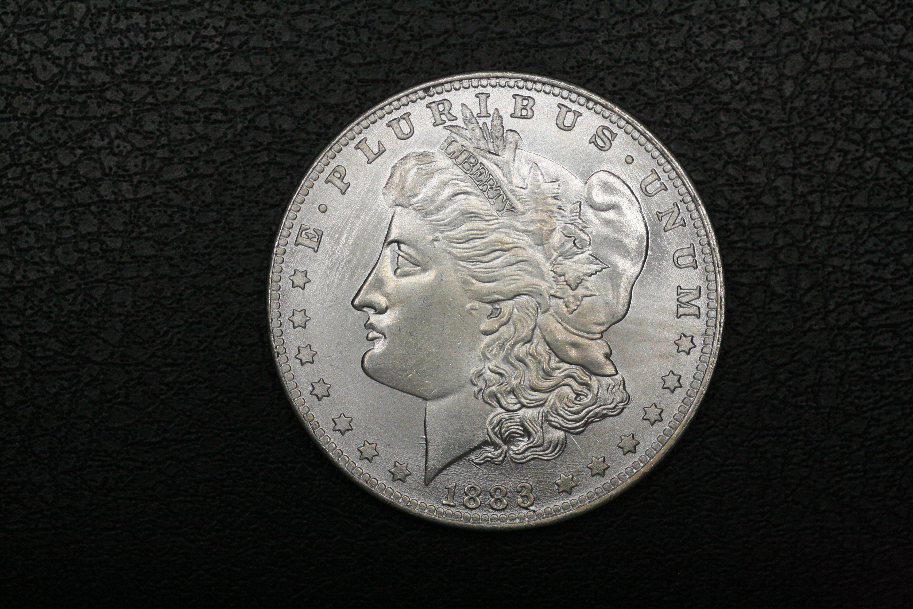 Close-up showing counterfeit coin flaws