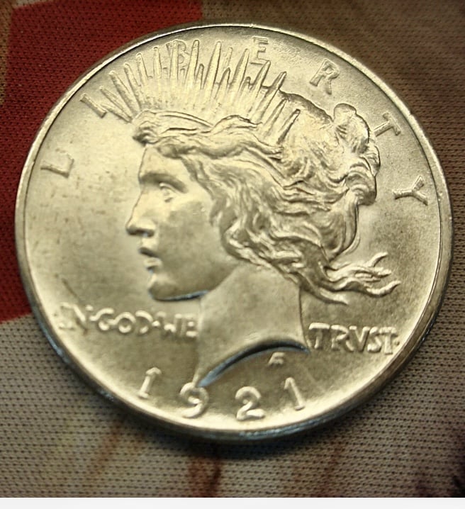 MS67 1921 Peace Dollar with weak strike vs strong strike coin