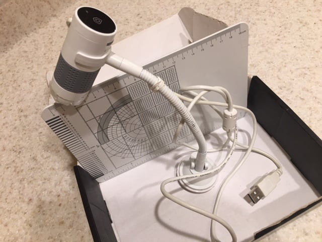 Smartphone macro setup capturing coin details